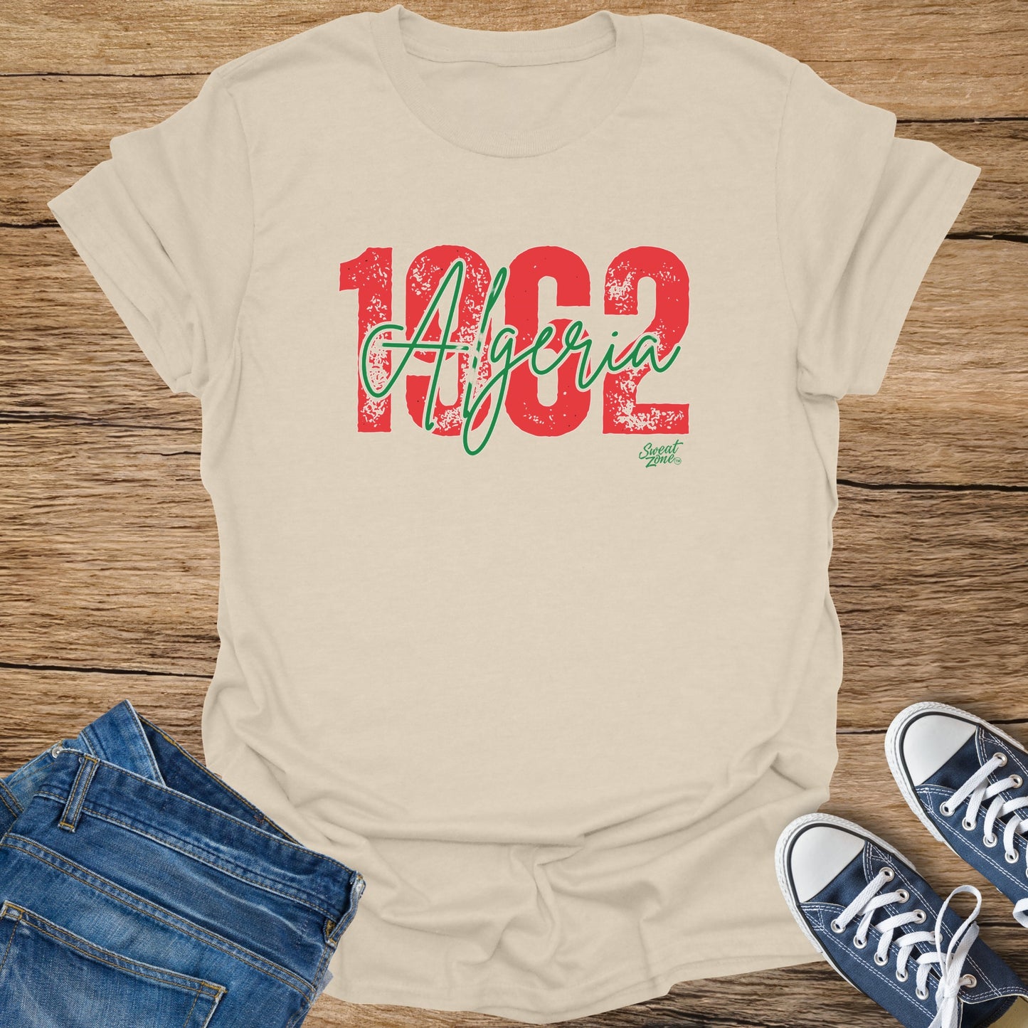 Cream t-shirt with red and green "1962 Algeria" graphic and "Sweat Zone" logo.