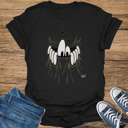 Black t-shirt with a cartoon character peeking from torn fabric, "Sweat Zone" logo, jeans, and sneakers.