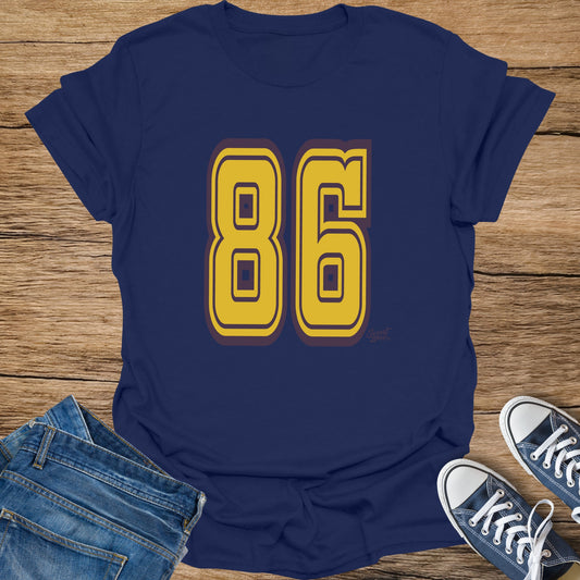 Navy blue t-shirt with gold and purple "86" graphic.