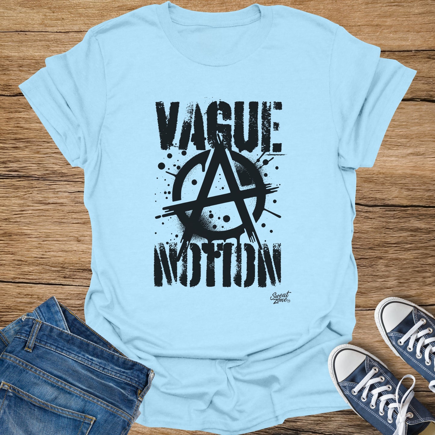 Light blue t-shirt with "VAGUE ANARCHY MOTION" graphic in black.