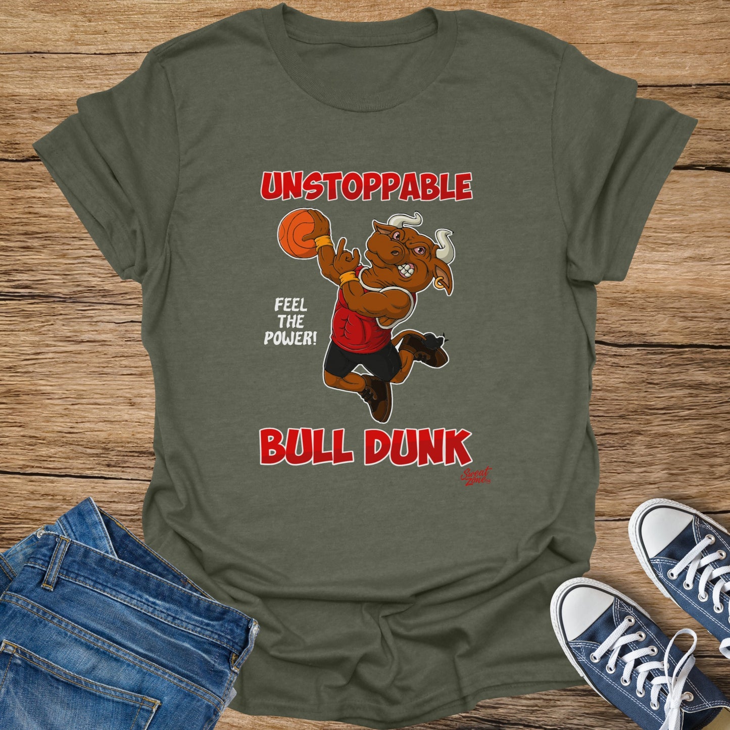 Green t-shirt featuring a cartoon bull dunking a basketball with text "Unstoppable", "Feel the Power!", and "Bull Dunk".