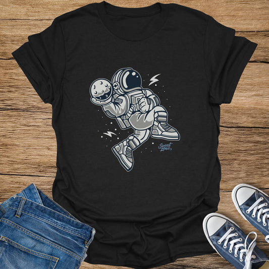 Black t-shirt with illustration of an astronaut holding the moon.