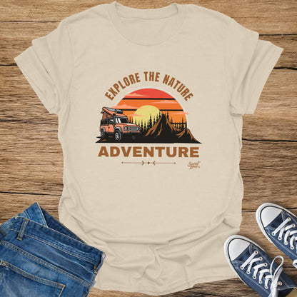 T-shirt with orange off-road vehicle, mountains, sunset, and text "ADVENTURE".