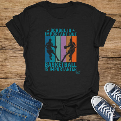 Black t-shirt with "School is Important But Basketball Is Importanter" graphic.